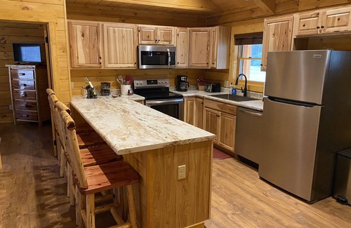 Ferguson Cabin | Cozy Log Cabin Retreat with Hot Tub & Rushing Trout Stream