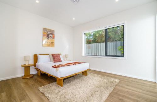 Ainslie House | Modern 4-Bedroom City Home with Tesla Charger Awaits You