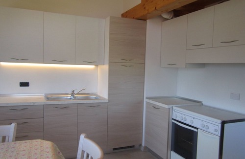 Daiano Apartment | Bright Attic Escape with Pool & Pet-Friendly Amenities