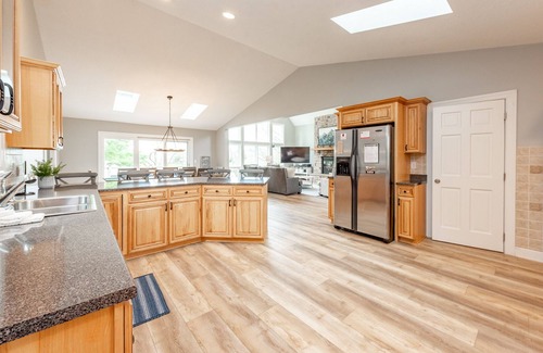 Waterfront Greens House | Lakefront Retreat with Dock Slip, Hot Tub & Fire Pit!