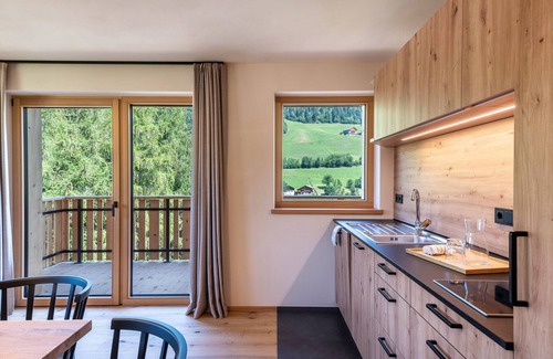 Santa Maddalena Apartment | Modern Apartment Poma: Mountain Views & Relaxing Garden
