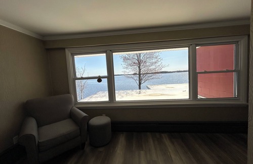 Alpena House | NEW LISTING! Spacious 4-bedrooms lake front retreat in delightful Alpena area.
