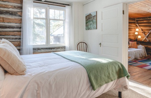 Alanson House | Inviting Log Cabin Retreat with Ocean Views and Modern Comforts