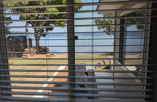 Carp Lake Cottage | Renovated Lakeside Cottage with Private Beach & Ocean View