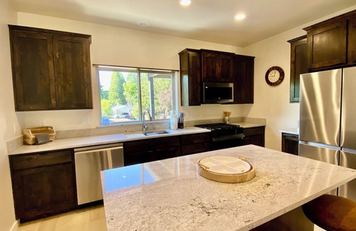 Grants Pass House | New Riverfront Retreat Home on 1 Acre - WiFi, A/C, Covered Deck and Spa