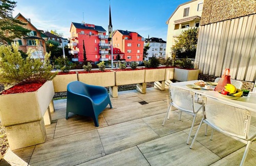 Oerlikon Apartment | Bright Studio Retreat with Sunny Terrace & Child-Friendly Perks