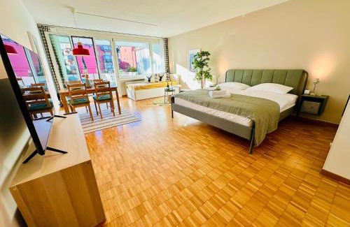Oerlikon Apartment | Bright Studio Retreat with Sunny Terrace & Child-Friendly Perks