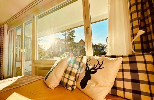 Oerlikon Apartment | Bright Studio Retreat with Sunny Terrace & Child-Friendly Perks
