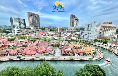 Bunga Paya Pantai Apartment | Experience TheShore: 4-Star RiverView Oasis with Pool
