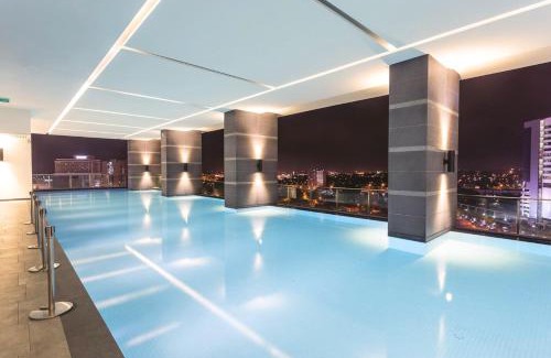 Bunga Paya Pantai Apartment | Experience TheShore: 4-Star RiverView Oasis with Pool