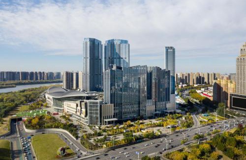 He Ping Hotel | Discover New World Shenyang Hotel: 5-Star Stay Awaits