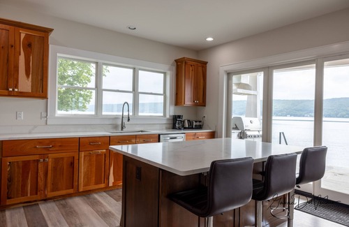 Cameron House | New Construction Beachfront Home with Dock and Hot Tub