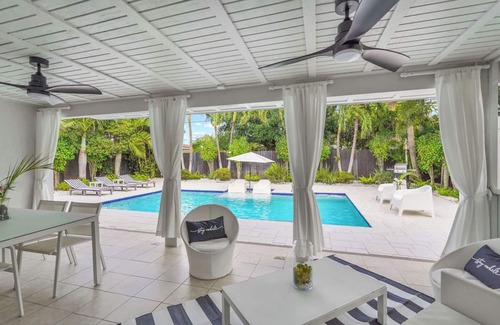 North Andrews Gardens House | Stylish Cabana Retreat with Heated Pool Near Beautiful Beaches