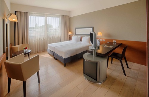 Peschiera Borromeo Hotel | Discover NH Linate: 4-Star Comfort with Spa & Dining