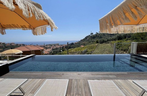 San Lorenzo al Mare Apartment | Inviting Apartment for 4 with Pool, Ocean View & Parking
