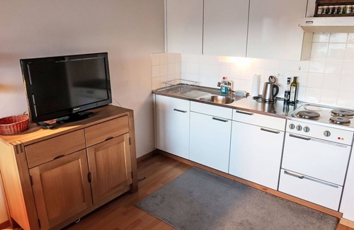 Laax Apartment | Nice apartment for 3 guests with pool, WIFI, TV, balcony, pets allowed, panoramic view and parking