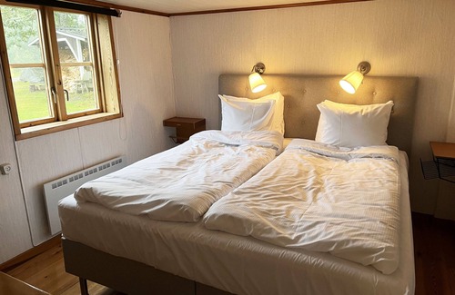 Farbo House | Cozy Cottage Retreat in Historic Mill Setting with Ocean View