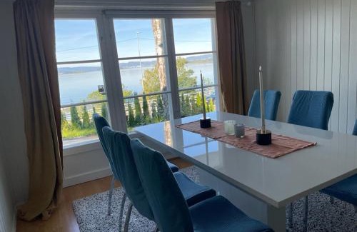 Oslo Apartment | Nice Family Friendly apartment 2 bed Rooms with sea view located in Nordstrand for 5 guests with a garden and grill with sea view just beside the apartment