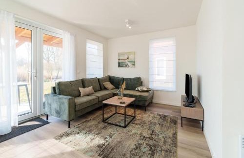 Municipality of Nissewaard House | Relaxing Holiday Home with Sauna by a Scenic Lake