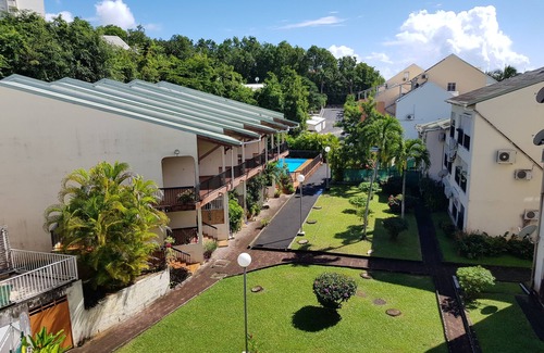 Bas du Fort Apartment | Stylish Duplex Steps from the Beach with Pool & Spa