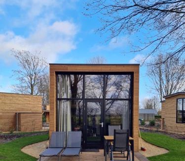 Hulshorst House | Cozy Tiny House by the Water in Nature's Embrace