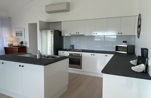 Waterhouse House | Discover No 5: Ocean Blue Views & Family-Friendly Amenities