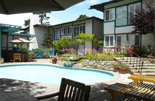 Golden Rectangle Hotel | Relax at Normandy Inn: Poolside Retreat with High Ratings