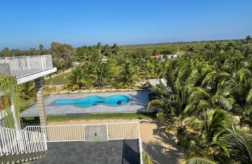 Pachchilaipalli House | Relax at North Joy Resort with Pool and Oceanfront Views