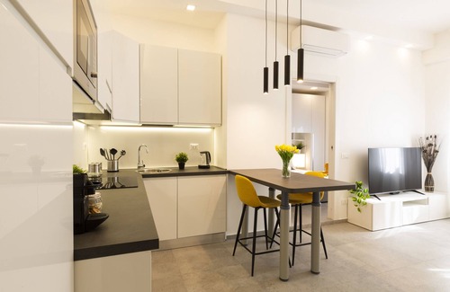 Giambellino Apartment | Top-Rated notaMi in Flower District with Family-Friendly Amenities