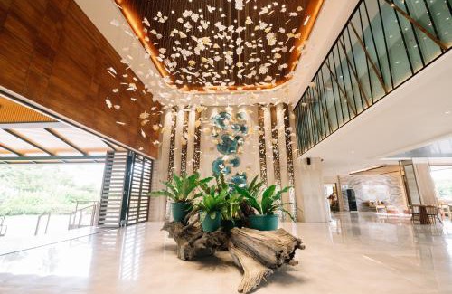 Mahinog Resort | Relax at Nouveau Resort: Oceanfront Bliss with Pool Access