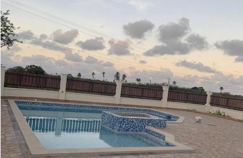 Buccoo Villa | Discover Nzingha's Villa: 4-Star Stay with Pool Access