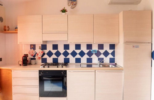 Porto Ottiolu Apartment | Cozy Oasis Near Beach with Ocean Views and Pet-Friendly Amenities