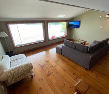 Stoke Ski Chalet | Discover L'Oasis: Family-Friendly Retreat with Hot Tub Access