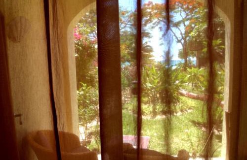 Pereybere Hotel | Ocean Beauty: Relax by the Private Beach and Poolside Haven