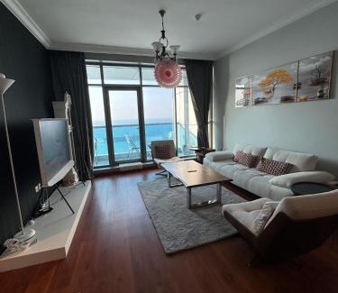 Rumailah Apartment | Ocean View Suites: 4-Star Experience with Hot Tub & Pool