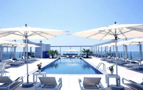 Ras Al Khaimah Apartment | Beachfront Escape at Ocean Whisper Apartment - Al Marjan Island