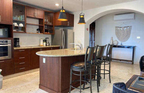 Majahual Apartment | Oceanfront Penthouse with Rooftop Pool and BBQ Area