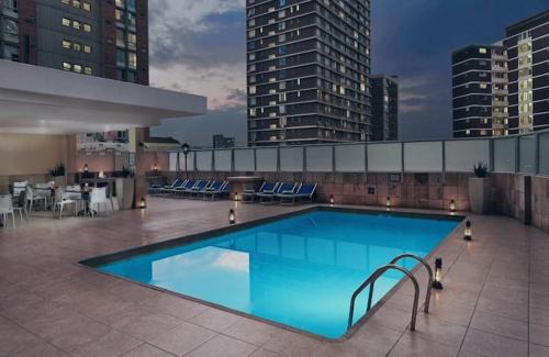 North Beach Apartment | Oceanic Unit 122: Beachfront Bliss with Pool & Ocean Views