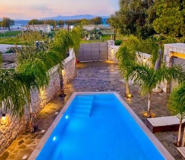Petaloudes Apartment | Oceanfront Odyssea Sea View Apartment Steps from the Beach