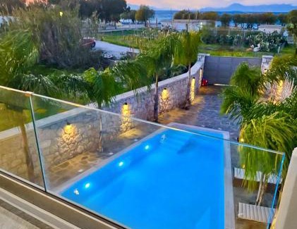 Petaloudes Apartment | Oceanfront Odyssea Sea View Apartment Steps from the Beach