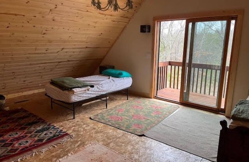 Manistee Cabin | Eco-Friendly Solar Cabin Retreat by Manistee River