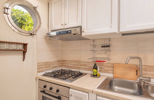 Olbia City Centre Apartment | Olbia Centre City Apartment with Private Terrace & Shared Garden