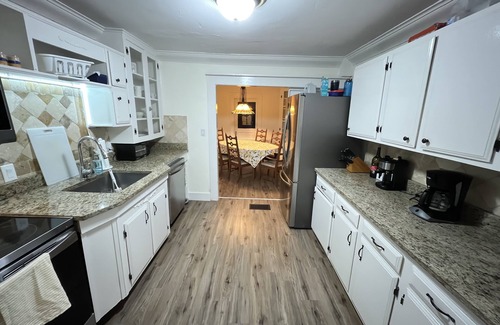 Eustis House | Discover Timeless Old Florida Charm with Top-Rated Amenities