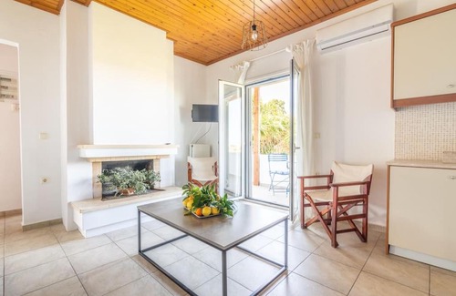 Malevizi Apartment | Beachside Olive Apartment: Child-Friendly Retreat Awaits
