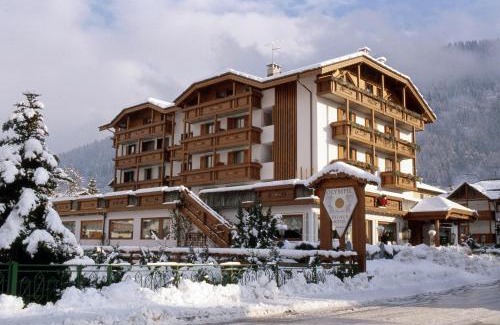 Pinzolo Hotel | Experience the Olympic Palace: Oceanfront Paradise Awaits
