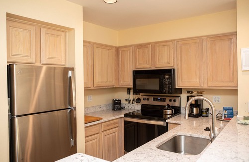 Lakeside Village Condo | Beautiful Retreat on Keystone Lake with Pool & Spa Access