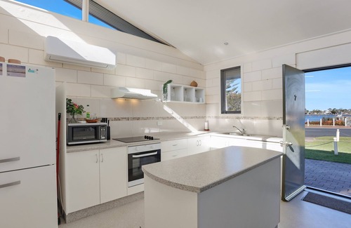 Merimbula Apartment | Pet-Friendly Retreat at Penguin Mews with Lake Views