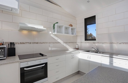 Merimbula Apartment | Pet-Friendly Retreat at Penguin Mews with Lake Views