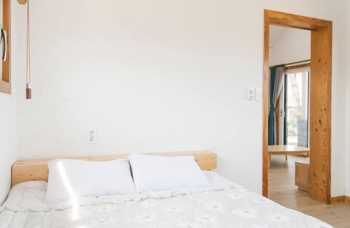 Seongsan House | Relax at On The Stone Pension: Oceanfront Pet-Friendly Retreat