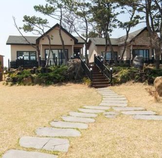 Seongsan House | Relax at On The Stone Pension: Oceanfront Pet-Friendly Retreat